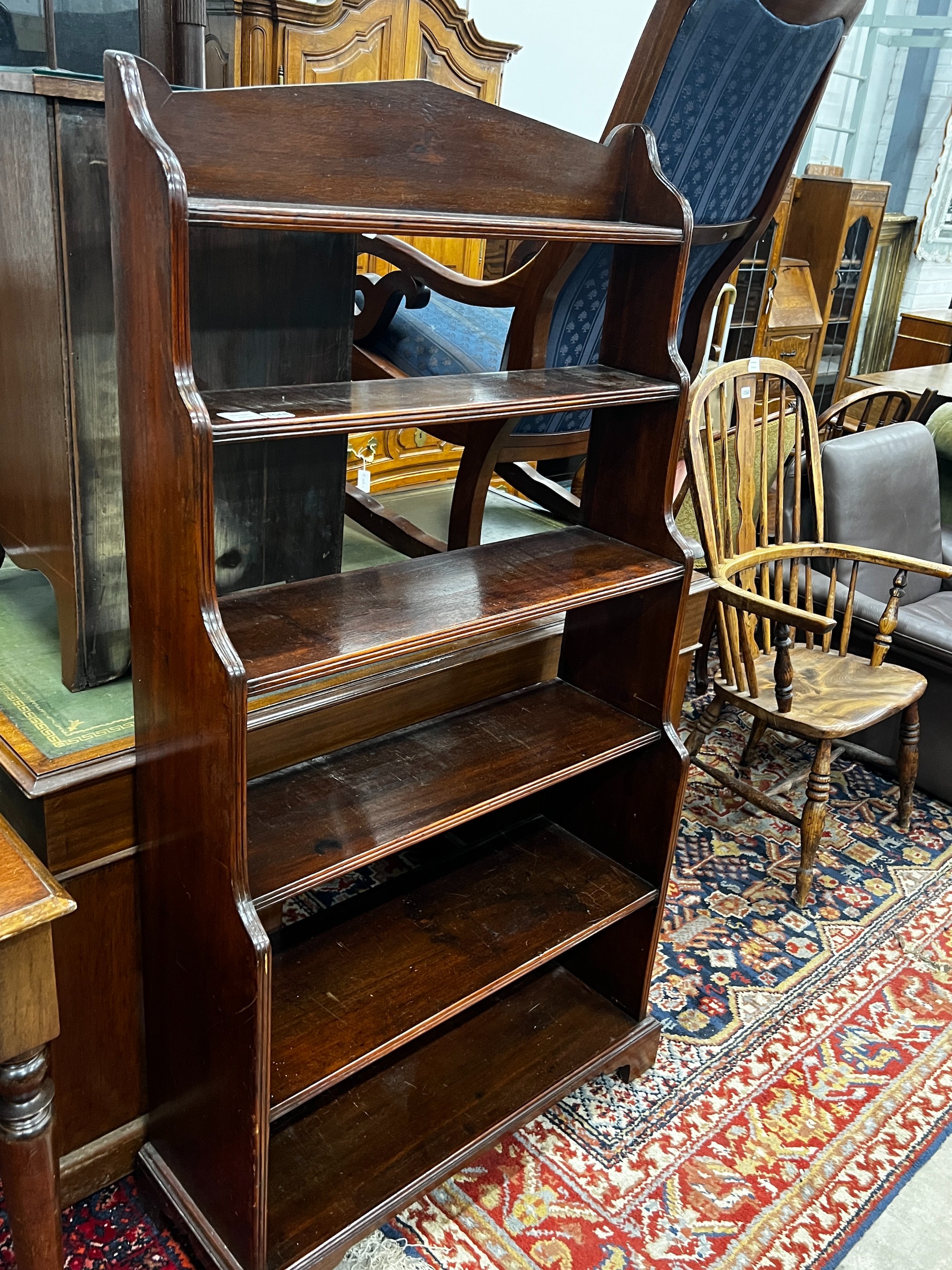 A 19th century mahogany graduated open bookcase, length 82cm, depth 31cm, height 152cm